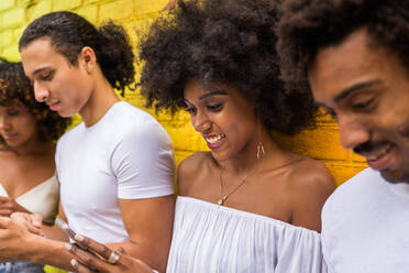 Group of afroamerican friends bonding in Manhattan, New York - Young adults having fun outdoors, concepts about lifestyle and young adult generation - DMDF02036