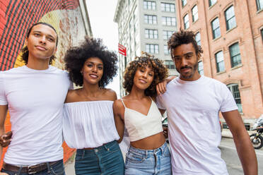 Group of afroamerican friends bonding in Manhattan, New York - Young adults having fun outdoors, concepts about lifestyle and young adult generation - DMDF02038