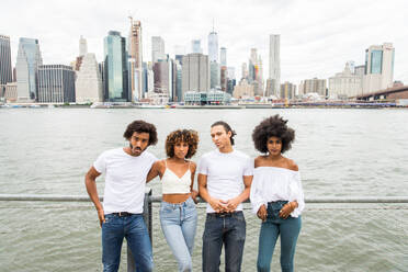 Group of afroamerican friends bonding in Manhattan, New York - Young adults having fun outdoors, concepts about lifestyle and young adult generation - DMDF02044