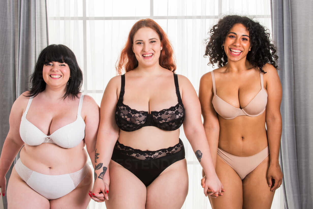 Multi-ethnic group of beautiful women posing in underwear in a beauty  studio - Multicultural fashion models showing their beautiful bodies as  they are, concepts about beauty, acceptance and diversity stock photo