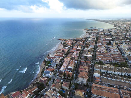 Spain, Valencian Community, Mil Palmeras, Aerial view of coastal town - DMHF00092