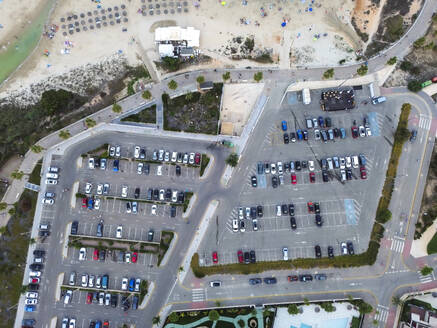 Spain, Valencian Community, Mil Palmeras, Aerial view of beachside parking lot - DMHF00093