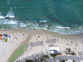 Spain, Valencian Community, Mil Palmeras, Aerial view of umbrellas on sandy beach - DMHF00094