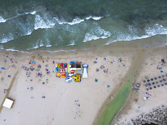 Spain, Valencian Community, Mil Palmeras, Aerial view of umbrellas on sandy beach - DMHF00095