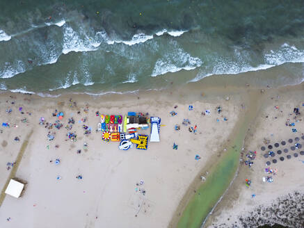 Spain, Valencian Community, Mil Palmeras, Aerial view of umbrellas on sandy beach - DMHF00095