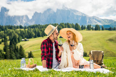 Beautiful young couple travelling in the Dolomites, Italy - Two lovers having a day trip in the nature - DMDF02147