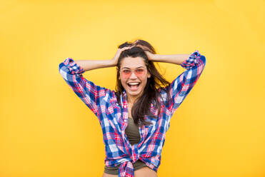 Portrait of stylish pretty girl on colored background - Happy woman with urban styled attire, concepts about lifestyle and youth - DMDF02207