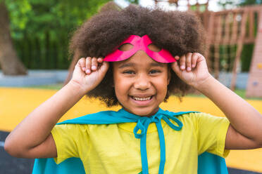 Kid wearing superhero costumes and having fun outdoors - DMDF02361