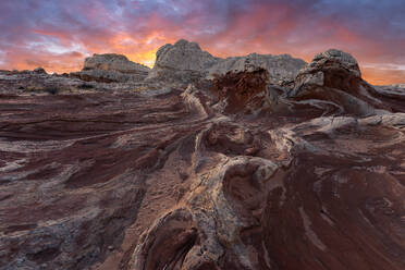 Picturesque scenery of rough rocky mountains under cloudy purple and blue sky at sundown in evening - ADSF46619