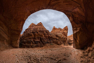 Picturesque view of rough rocky arched mountain against cloudy sky - ADSF46630