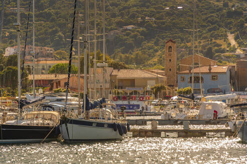 View of harbour and boats and church at Cannigione, Cannigione, Sardinia, Italy, Mediterranean, Europe - RHPLF26781