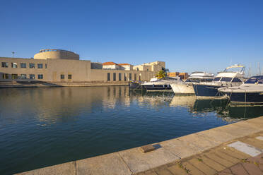 View of Archaeological Museum of Olbia and harbour boats on sunny day on Olbia, Olbia, Sardinia, Italy, Mediterranean, Europe - RHPLF26804