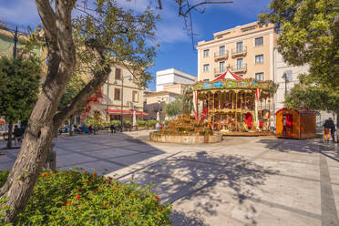 View of carousel and fountain on Piazza Matteotti on sunny day in Olbia, Olbia, Sardinia, Italy, Mediterranean, Europe - RHPLF26808