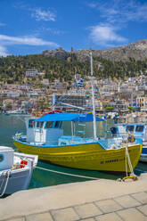 View of harbour boats in Kalimnos with hills in the background, Kalimnos, Dodecanese Islands, Greek Islands, Greece, Europe - RHPLF26817