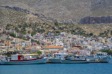 View of port and town of Kalimnos with hills in the background, Kalimnos, Dodecanese Islands, Greek Islands, Greece, Europe - RHPLF26820