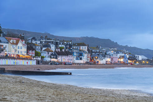 View from the beach of the colouful village of Lyme Regis at dusk, Jurassic Coast, UNESCO World Heritage Site, Dorset, England, United Kingdom, Europe - RHPLF26896