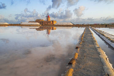Reflection of the windmill in the salt flats at dawn, Saline Ettore e Infersa, Marsala, province of Trapani, Sicily, Italy, Mediterranean, Europe - RHPLF26901