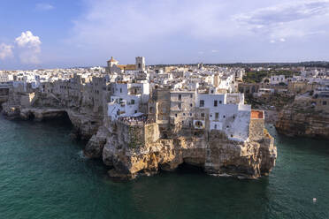 The white buildings on top of the cliff of the fishing village of Polignano a Mare, Bari province, Apulia, Italy, Europe - RHPLF26928
