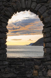 Beautiful sunset view of the Ligurian coast, viewed from the rock window of Portovenere village, La Spezia province, Liguria district, Italy, Europe - RHPLF26940