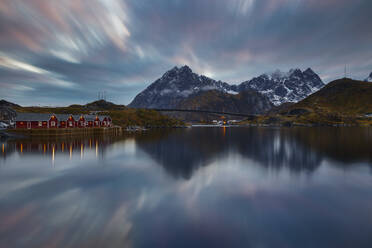 Norwegian fjord at blue hour with typical illuminated red cabins, Moskenesoya, Nordland, Lofoten, Norway, Scandinavia, Europe - RHPLF26956