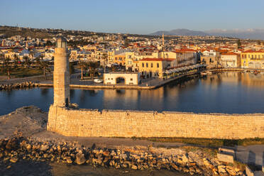 Lighthouse at the Venetian harbor with a view over, Rethymno, Crete, Greek Islands, Greece, Europe - RHPLF26981
