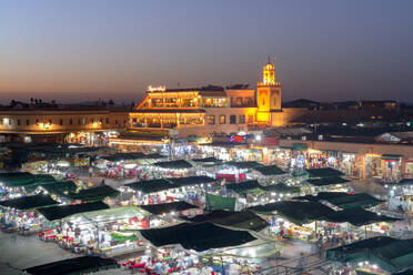 Dusk lights over the iconic markets in Jemaa el Fna square, UNESCO World Heritage Site, Marrakech, Morocco, North Africa, Africa - RHPLF27003