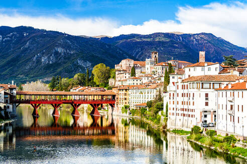 Historic buildings and Ponte Degli Alpini reflected in river Brenta, Bassano Del Grappa, Vicenza province, Veneto, Italy, Europe - RHPLF27013