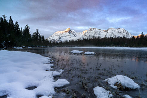 Snowy mountains surrounding the frozen lake Entova, Valmalenco, Valtellina, Lombardy, Italy, Europe - RHPLF27015