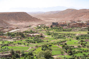 High angle view of Ait Ben Haddou ksar, UNESCO World Heritage Site, surrounded by green fields, Ouarzazate province, Morocco, North Africa, Africa - RHPLF27023
