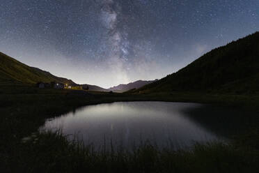 Milky Way over the alpine pond of Pozza Blu, Macolini, Madesimo, Valle Spluga, Valtellina, Lombardy, Italy, Europe - RHPLF27029