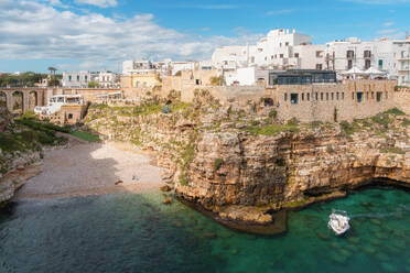View of beach and old town on limestone cliffs, Polignano a Mare, Puglia, Italy, Europe - RHPLF27061