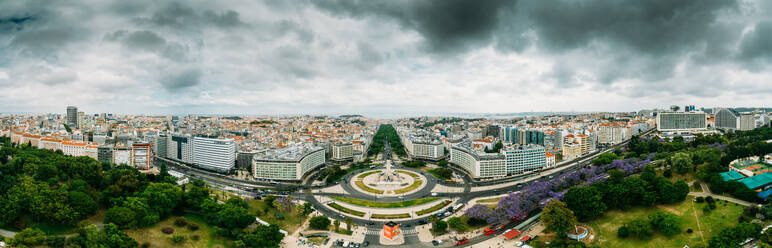 Aerial drone panoramic view of Parque Eduardo XII and Marques the Pombal looking south with Avenida da Liberdade in Lisbon, Portugal, Europe - RHPLF27085