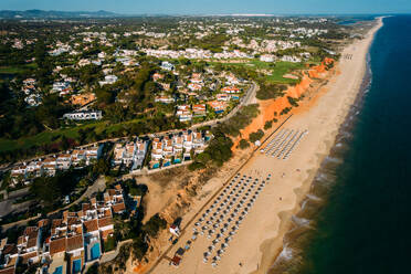 Aerial drone view of Vale do Lobo Beach, iconic beachfront resort and home, near Quarteira in Algarve, Portugal, Europe - RHPLF27088