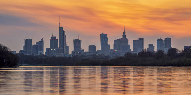 View over River Vistula towards City Centre Skyline at sunset, Warsaw, Masovian Voivodeship, Poland, Europe - RHPLF27126