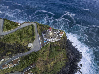 Aerial view of Farol do Arnel lighthouse and Arnel point, Sao Miguel island, Azores, Portugal, Atlantic, Europe - RHPLF27174