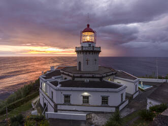 Farol do Arnel lighthouse at sunrise in a cloudy morning, Sao Miguel island, Azores, Portugal, Atlantic, Europe - RHPLF27175