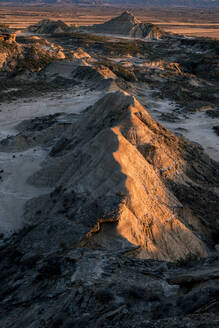 Bardenas Reales rock formation in the badlands, illuminated with the last sunset light, Navarre, Spain, Europe - RHPLF27185