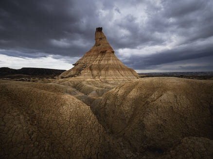 Castildetierra rock formation under a cloudy sky, the symbol of badlands of Bardenas Reales desert, Navarre, Spain, Europe - RHPLF27187