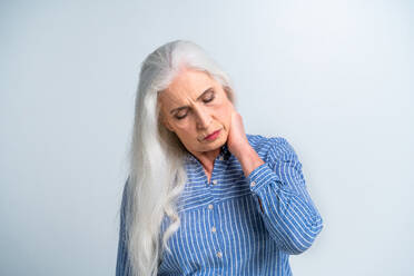 Beautiful senior woman portrait, studio shot on background - Elderly person, half body shot - DMDF02825