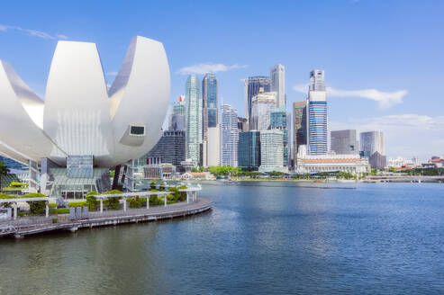 Singapore, Singapore City, ArtScience Museum with skyline skyscrapers in background - THAF03206