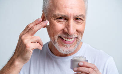 Handsome senior man portrait, studio shot on background - Elderly person, half body shot - DMDF03038