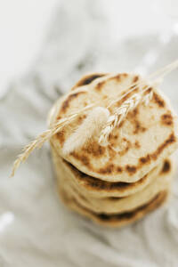 Stack of homemade sourdough pita breads - ONAF00623