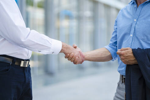 Business partners shaking hands after successful meeting - DIGF20514