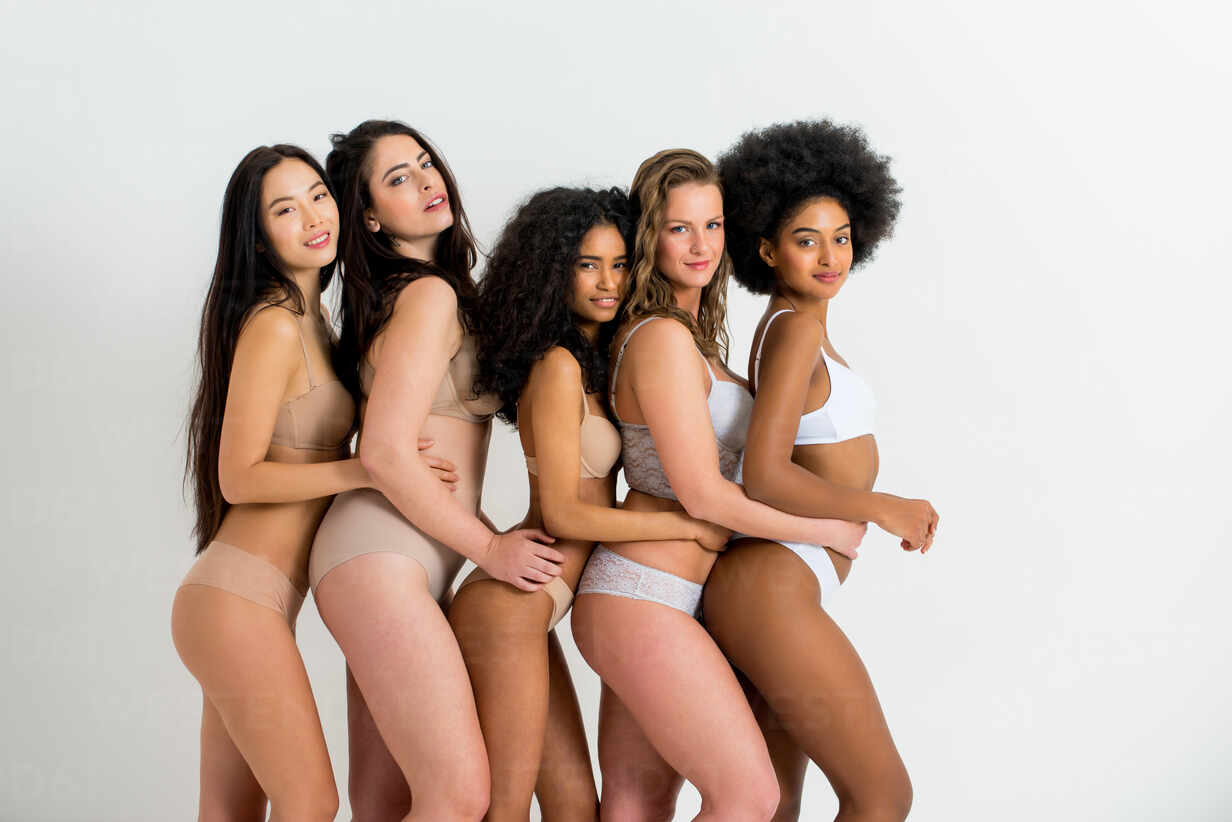 Multi-ethnic group of beautiful women posing in underwear in a