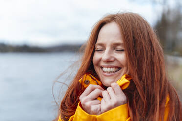 Happy redhead woman with eyes closed - KNSF09765
