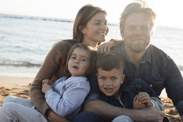 Smiling parents with children at beach on holiday - JOSEF20609