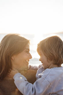 Happy mother and daughter enjoying at beach on weekend - JOSEF20637