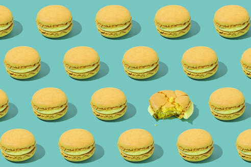 Yellow macaroons arranged on colored background - FLMF01007