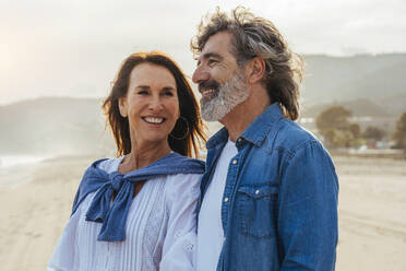 Happy woman with man at beach - OIPF03507