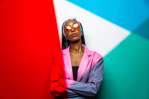 Beautiful afro-american woman with afro pigtails hairstyle and stylish clothes - Portrait of young black girl in studio - DMDF03807